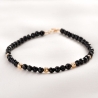 Faceted Onyx bracelet with 14K gold elements and closure